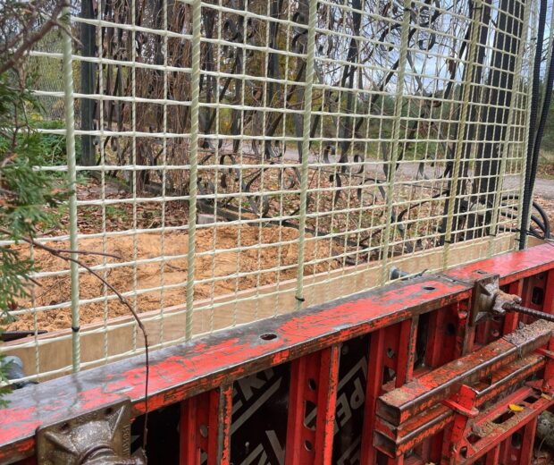 REBARMAT GFRP mesh and composite rebars installed in concrete formwork for corrosion-free foundation and retaining wall construction.